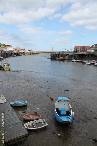 Obraz Whitby North Yorkshire UK 21st August 21 2024 Whitby a British seaside town  with boats moored in the harbour on a  hot summers