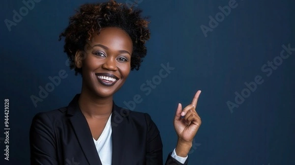 Obraz Smiling African Woman Pointing Upwards