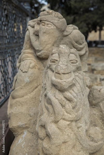 Obraz Azerbaijan, Baku . 01.01.2000 . An ancient statue made of stone. Maiden Tower Baku Stock Photos .