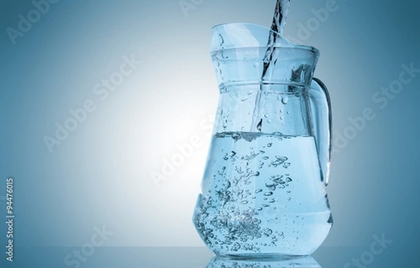 Obraz Water pouring into pitcher