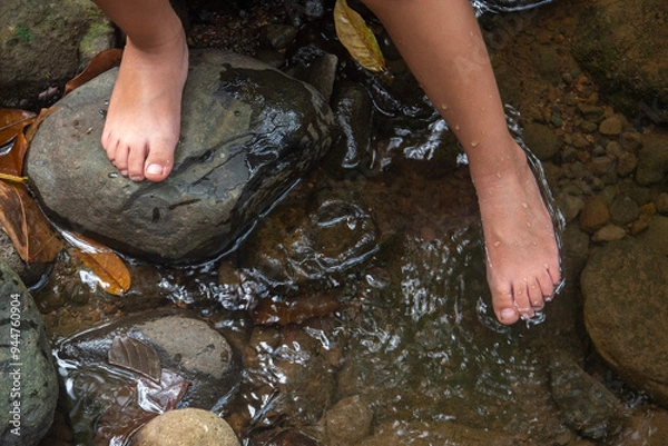 Obraz Feet of a person in water