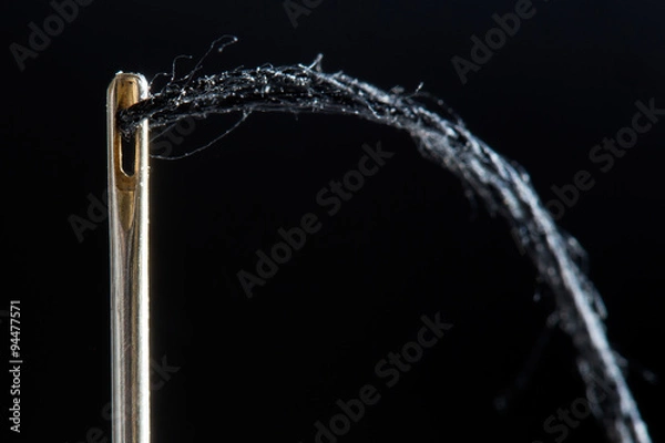 Fototapeta needle on a black background