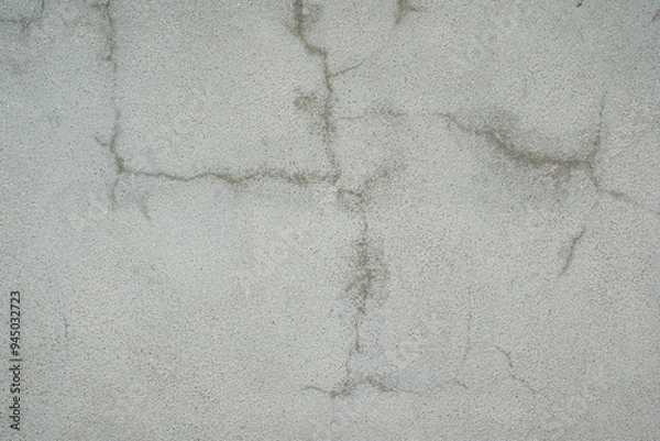 Fototapeta Grey cement wall with cracked or scratched on surface. Background and texture, close-up. 