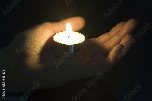Fototapeta Close-Up Of Candle In The Palm Of A Persons Hand