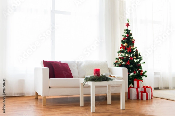 Fototapeta sofa, table and christmas tree with gifts at home