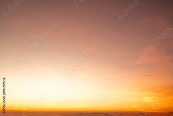 Fototapeta Beautiful , luxury soft gradient orange gold clouds and sunlight on the blue sky perfect for the background, take in everning,Twilight, Large size, high definition landscape photo