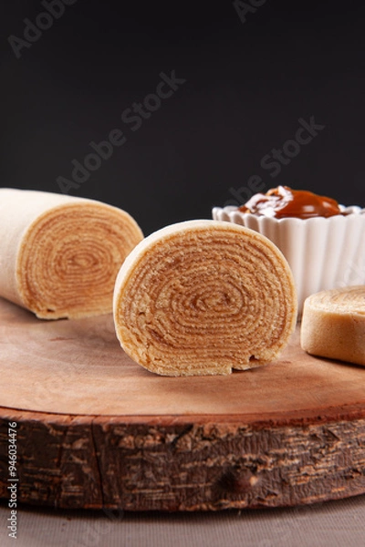 Fototapeta Typical dessert from northeastern Brazil called Bolo de Rolo. Stuffed with dulce de leche or guava paste. Selective focus