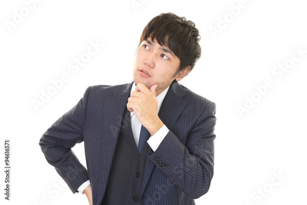 Fototapeta 考え事をする男性