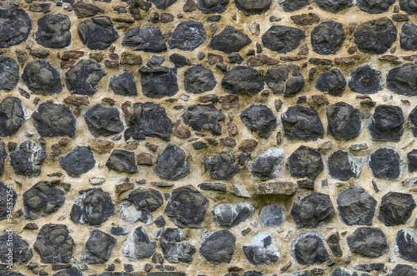 Fototapeta Mauer aus Basaltsteinen