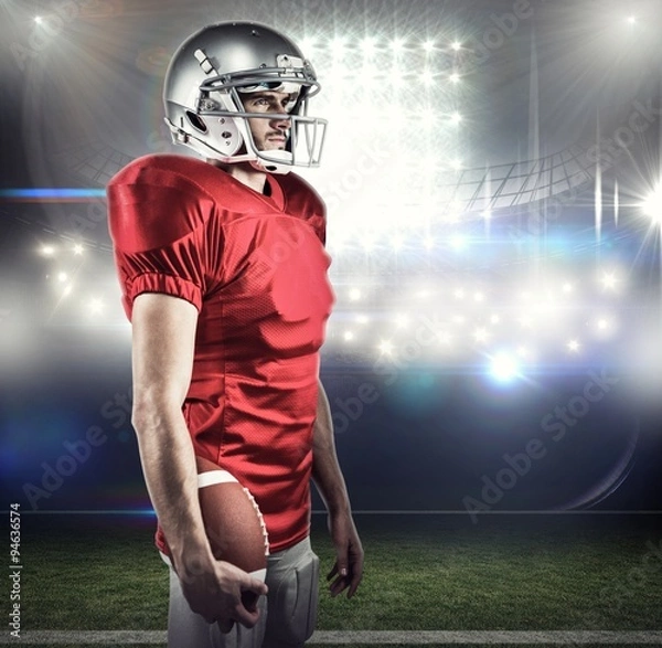 Fototapeta Composite image of serious american football player