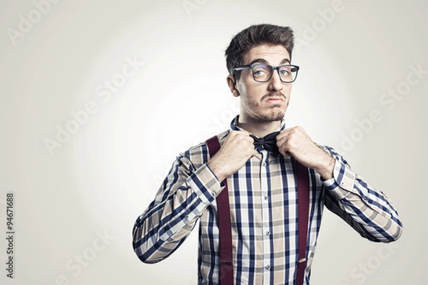 Obraz Funny portrait of young nerd with eyeglasses isolated on background