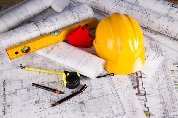 Obraz Buildings under construction and cranes

