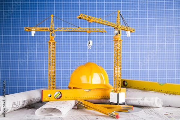 Obraz Buildings under construction and cranes
