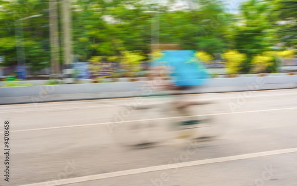 Fototapeta A racing bike rider's slow speed shutter