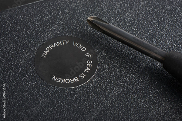 Fototapeta closeup of screwdriver and warranty seal