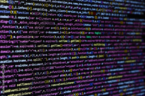 Fototapeta Programming code abstract screen of software developer. Computer script