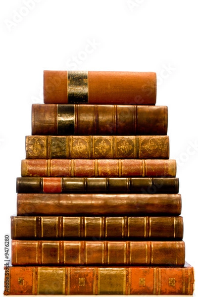 Obraz A row of antique leather books isolated on a white background