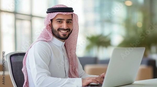 Obraz Arab businessman using a laptop