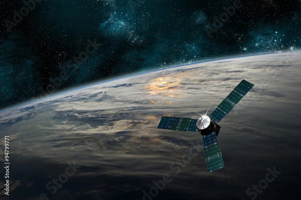 Fototapeta A satellite orbits Earth - Elements of this image furnished by NASA.