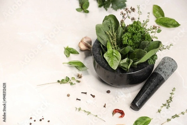 Fototapeta Mortar with different aromatic herbs on white table, space for text