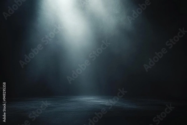 Obraz A dramatic beam of light illuminates a dark space, creating a mysterious and moody atmosphere perfect for artistic visuals.