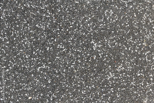 Fototapeta Playground soft rubberised impact absorbing safety surface black with white speckles texture