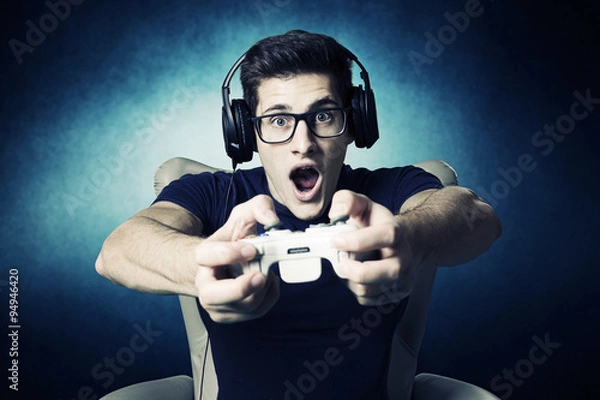 Obraz videogame addicted young guy playing with console 
