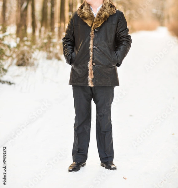 Fototapeta Man  in winter park 