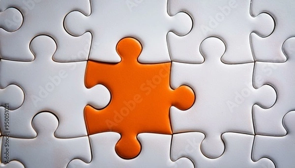 Fototapeta Picture of an orange puzzle piece that fits into a white puzzle. Teamwork, solutions, and problem-solving concepts are emphasized.