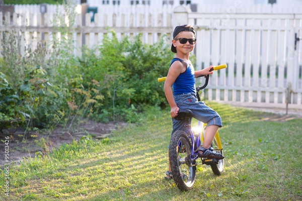 Obraz Boy with a bike