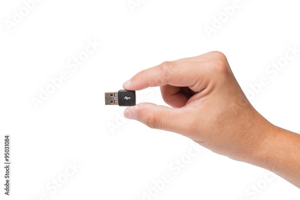 Obraz Hand holding USB device isolated on white