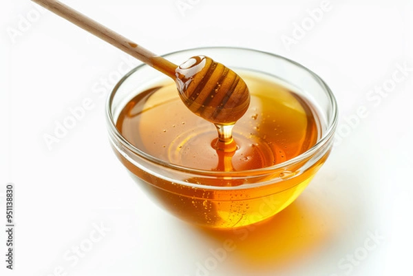 Obraz A bowl of honey with the honey dipper on white background. Generative AI