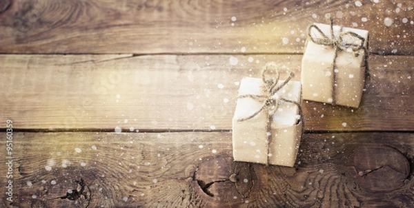 Obraz Christmas presents on dark wooden background in vintage style