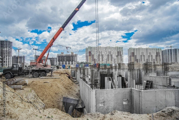 Obraz Column formwork and crane on house construction.