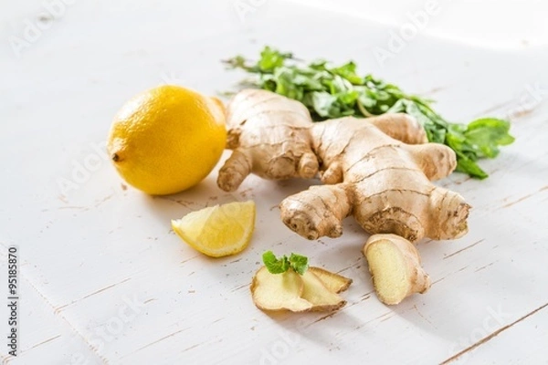 Obraz Ginger lemon mint on white wood background