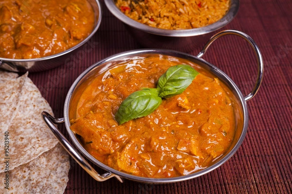 Fototapeta Chicken Tikka Masala Curry on Rattan Background