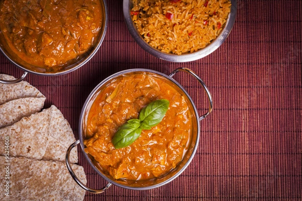 Fototapeta Chicken Tikka Masala Curry on Rattan Background