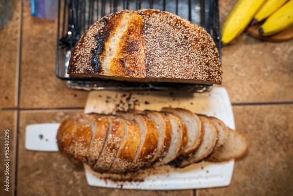 Obraz Freshly Sliced Artisan Sesame Bread with Golden Crust