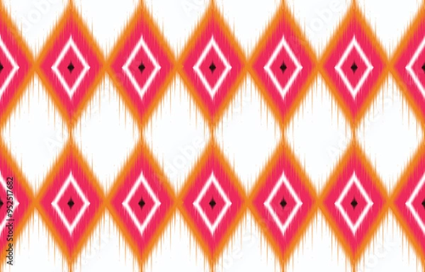 Fototapeta Colorful ikat seamless pattern. Bohemian diamond shapes in pink and orange. Ethnic textile design for fabric or wallpaper. Trendy ikat-inspired geometric print. Vibrant ikat background.