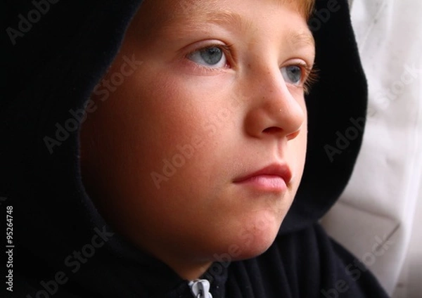 Obraz Young hooded child looking thoughtful
