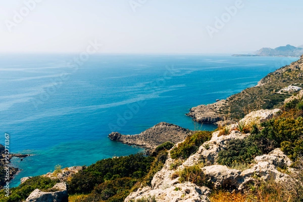 Fototapeta View of the coast of the island of Rhodes. The mountains of Rhodes, the sea in the background