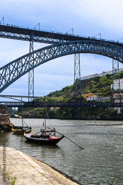 Fototapeta View of Porto city and Douro river and Dom Luis bridge. Porto, Vila Nova de Gaia, Portugal. Cityscape along the river