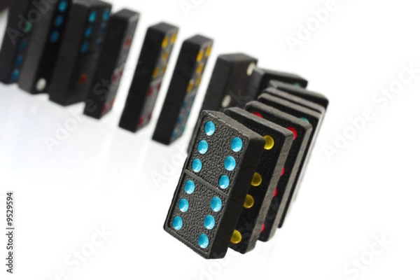 Fototapeta Vintage colored dominoes, in a row ready to fall.