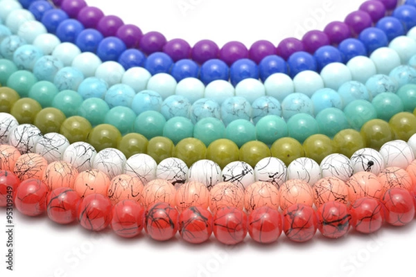 Fototapeta Rainbow chaplet - multicolored glass and natural beads strung on thread