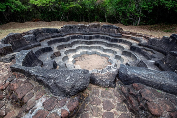 Fototapeta The stone carved Lotus Pond at the ancient site of Polonnaruwa in Sri Lanka. Designed to resemble a fully blown lotus flower it sits adjacent to the Jetavanarama built by King Parakramabahu the Great.