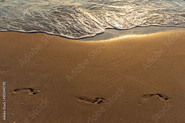 Fototapeta footprints on the beach