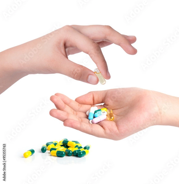 Obraz Drug capsules and pills in hand