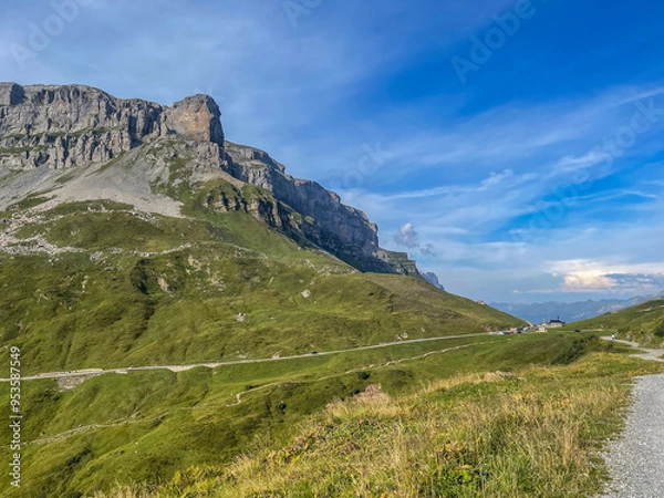Obraz mountain pass road top with chappelle and parking, hiking paths in summer, cliffs and summit of the Clariden mountain Swiss alps, Klausenpass, Switzerland