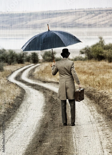 Fototapeta Retro style man under the rain, view from back