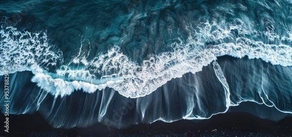 Fototapeta Aerial View of Waves Crashing on Black Sand Beach